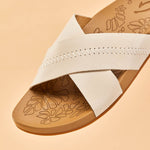OluKai Womens Kīpe‘a ‘Olu Leather Slide Sandals - Puka / Tan